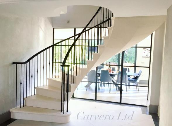A bespoke luxury floating post tensioned limestone staircase, Keston in Kent