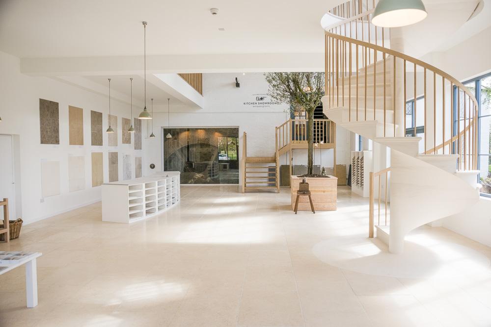 view into the showroom with spiral stone staircase 