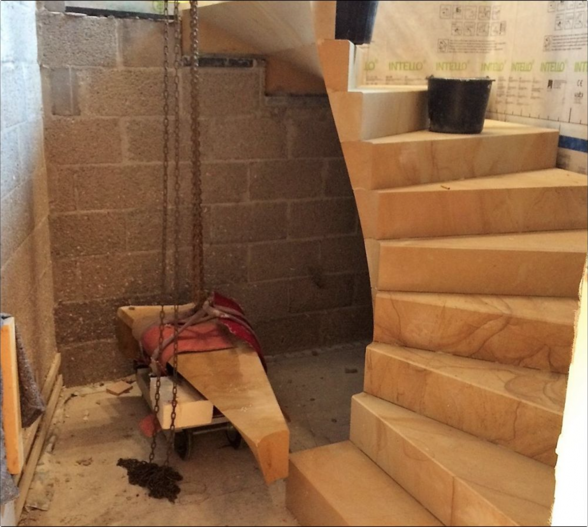 fitting of the cantilevered sandstone staircase