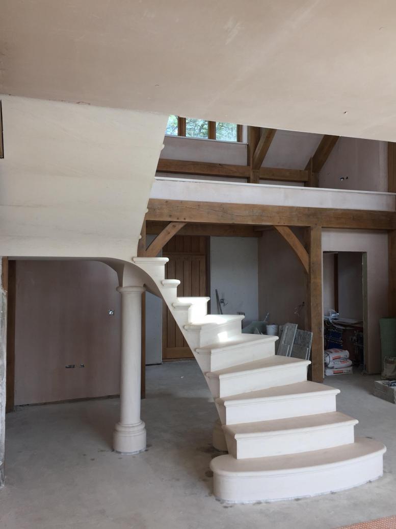 Floating post tensioned stone staircase