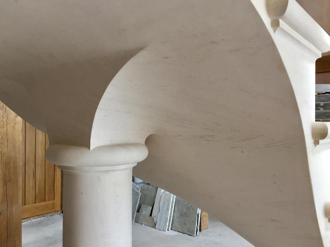 Floating post tensioned stone staircase