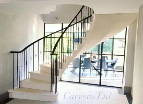 A bespoke luxury floating post tensioned limestone staircase, Keston in Kent