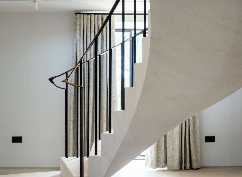 Floating post-tensioned limestone staircase at The Old Mill near Peterborough, designed and installed within a historic mill conversion.